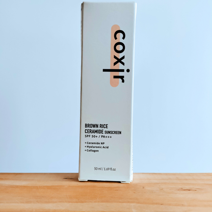 Coxir Brown Rice Ceramide Sunscreen SPF50+ PA+++ 50ml packaging box. 