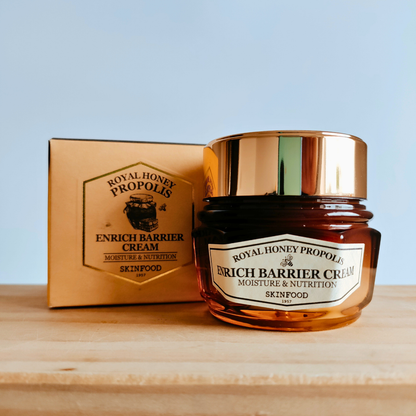 Skinfood Royal Honey Propolis Enrich Barrier Cream with packaging on a wooden surface